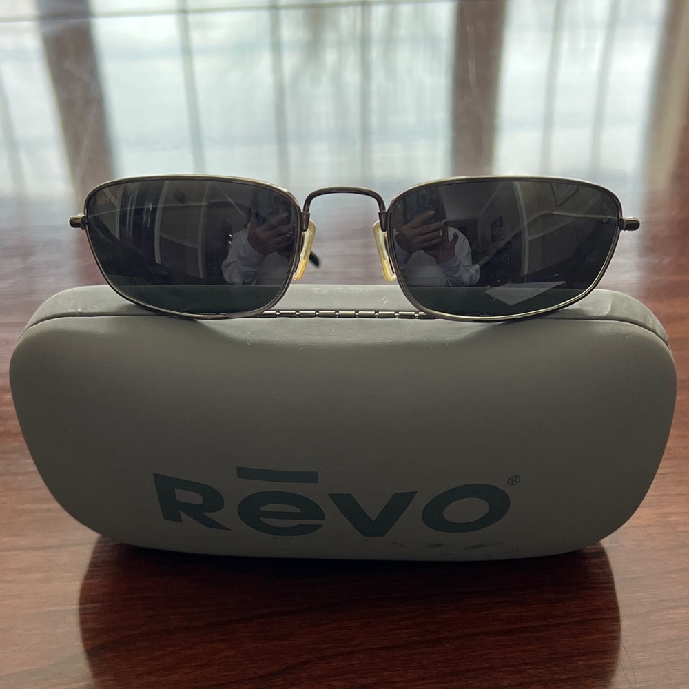 Revo Dark Lens Sunglasses with the Silver/Nickle Frame